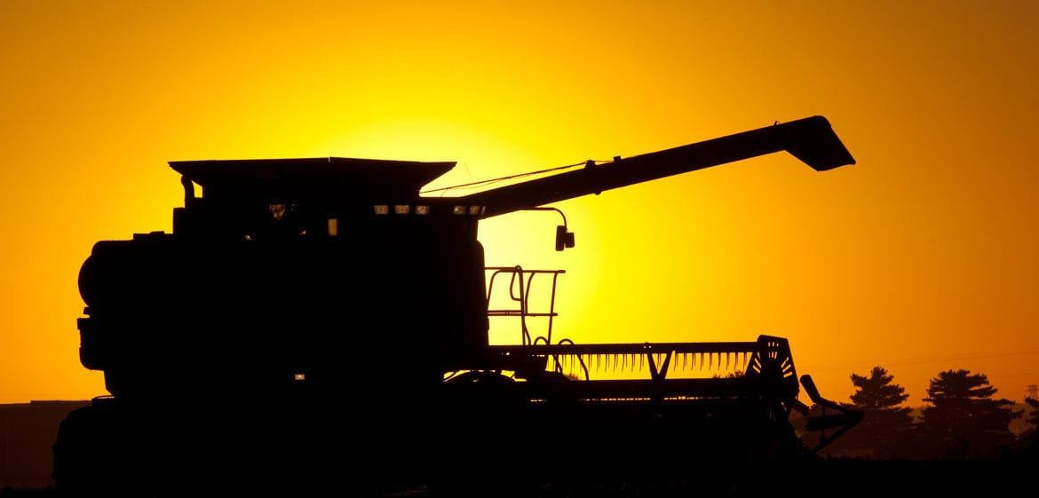 Farm Combine at Sunset