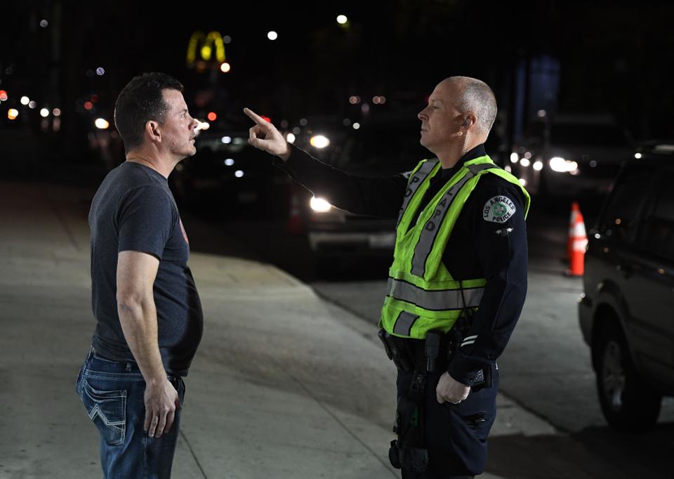 A man undergoes a sobriety test at a LAPD police DUI checkpoint in Reseda, Los Angeles, California ... [+]AFP VIA GETTY IMAGES